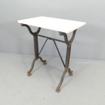 A rectangular marble topped garden table on cast iron frame. 60x72x40cm.