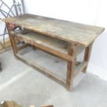 A vintage stained pine workbench, fitted with a No. 32 Rededa vice. 183x92x78cm.