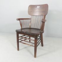 A late Victorian oak bow arm desk chair, with spindle back. Overall good used condition. Seat has