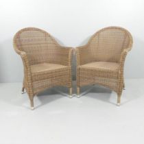 ALEXANDER ROSE - A pair of faux rattan armchairs suitable for indoor and outdoor use with maker's