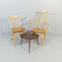 ERCOL - A model 391 dining chair, a Goldsmith carver chair and a pebble occasional table (3).