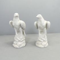 A pair of modern composite garden statues, studies of Eagles. Height 60cm.