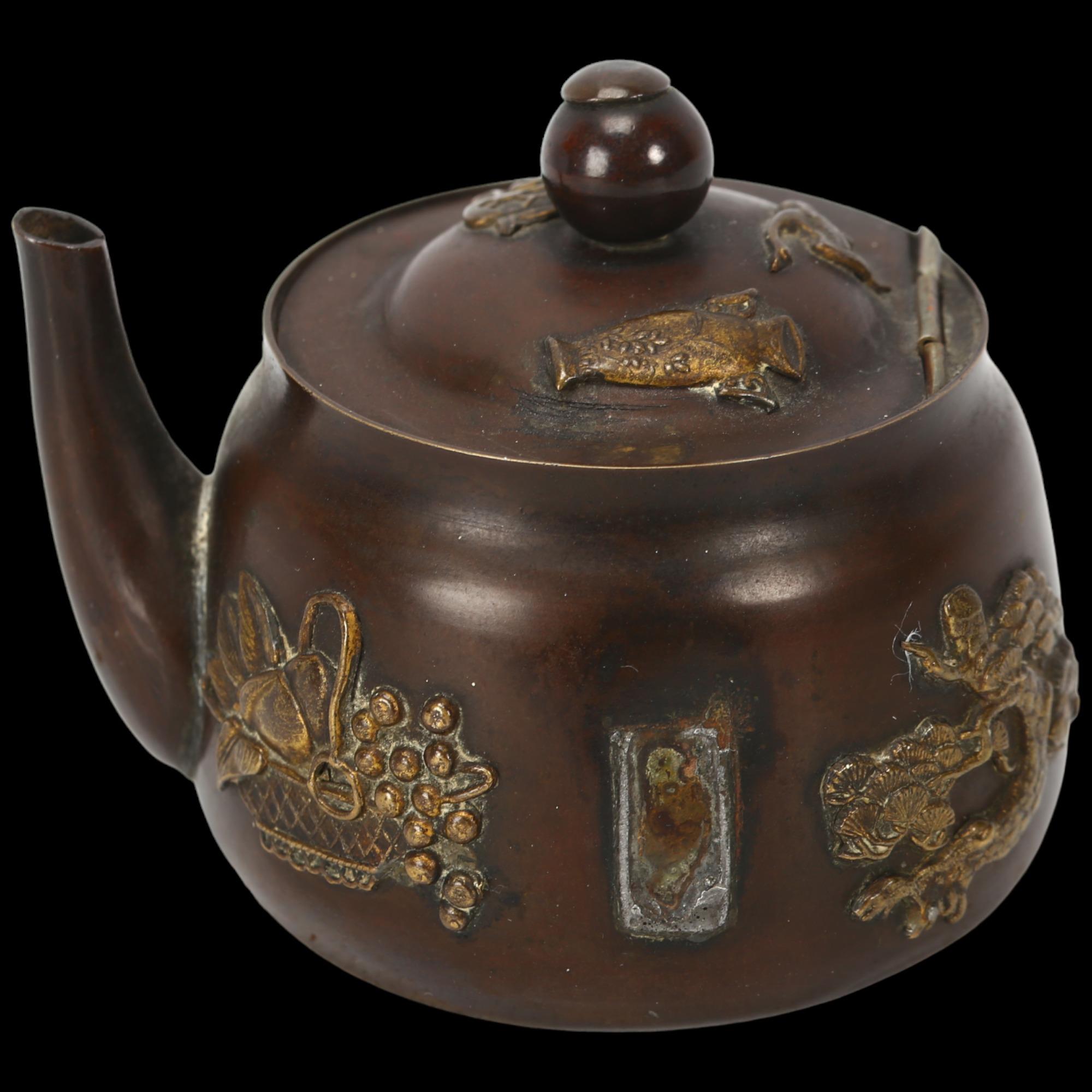 A Japanese Meiji Period miniature teapot design inkwell, with applied gilt-metal mounts, height