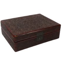 A Chinese Tixi lacquer box of rectangular form, with allover carved geometric design, 26.5cm x