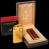 Dunhill red enamel pocket lighter, boxed, and a Ronson gold plated pocket lighter (2)