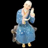 A Chinese porcelain figure cleaning his ears, height 16cm Missing 1 thumb otherwise good condition