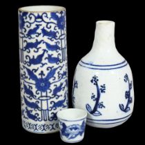 3 pieces of Oriental blue and white glazed ceramics, Chinese Cylinder vase and beakers with