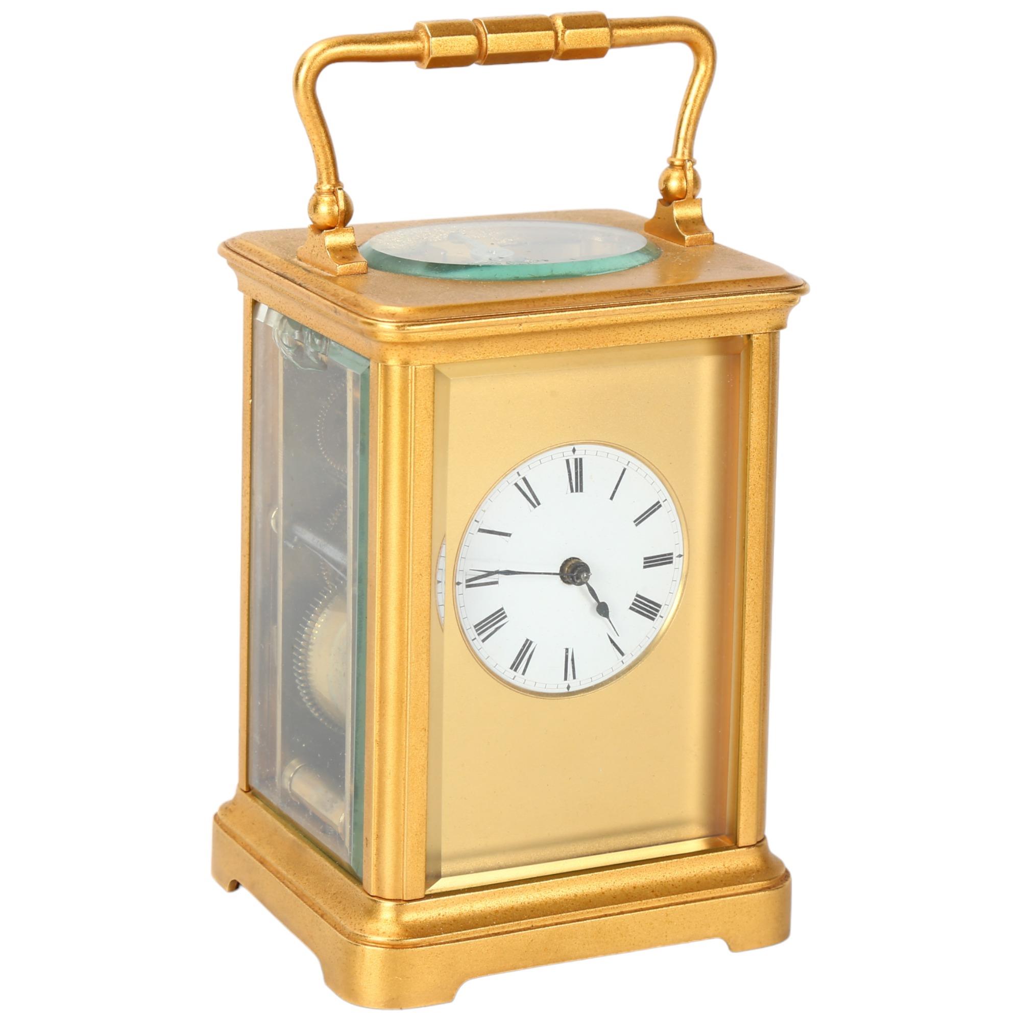 French gilt-brass carriage clock, enamel circular dial in gilded surround, 8-day movement striking