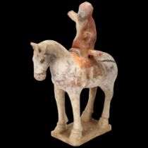 A Chinese Tang style terracotta horse and rider, height 26cm