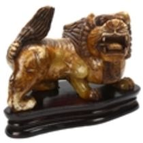 A large early 20th century Chinese soapstone dog of fo, length approx 41cm,