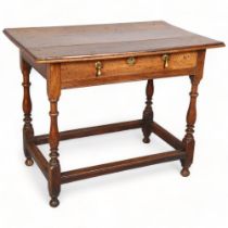 A George II oak lowboy, with plank top, ring turned column legs and brass pear-drop handles, 87 x 54