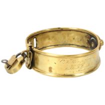 A 19th century brass dog collar with brass padlock and key, inscribed C F Kemp Esq, Fox Bush,