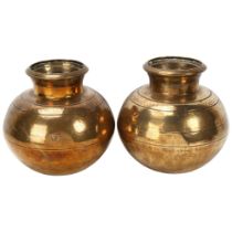 A pair of 19th century Indian heavy gauge brass vases, with engraved animals and geometric bands,