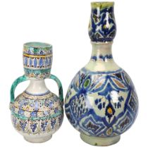 2 Middle Eastern Islamic pottery vases, with hand painted geometric decoration, largest height