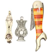 A lady's leg design novelty penknife, an ice skate design cigar cutter, and an unmarked lyre-