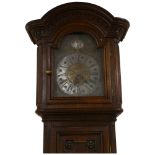 A Swiss 18th century tall oak 30-hour longcase clock, brass and silvered dial dated 1781 with