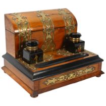 A 19th century brass-bound walnut desk stand with lidded stationery compartment, original coloured