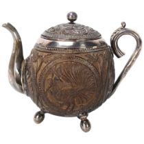 19th century Indian coconut shell teapot, relief carved peacock and elephant design panels, unmarked