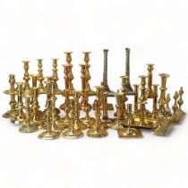 A large quantity of Antique brass candlesticks, 17th - 19th century