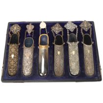 A cased set of 6 x 19th century spectacle cases, steel and nickel plate with belt hooks and