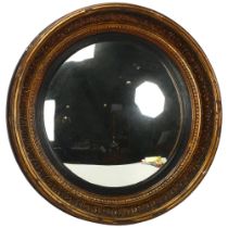 A 19th century gilt-gesso framed convex wall mirror, diameter 65cm Outer rim has a number of gesso