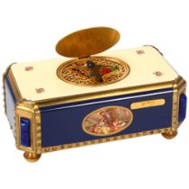 A bird automaton musical box, by Reuge Music Switzerland, blue and cream enamel case with rural