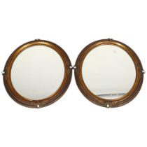 A pair of Victorian oval gilt-brass framed wall mirrors, with rope twist surrounds and inset opaline