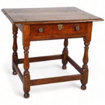 An 18th century oak low boy, circa 1720-30, with single frieze drawer and turned supports, 76 x