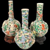 3 Chinese porcelain bottle vases, late 19th/early 20th century, with relief moulded figures and