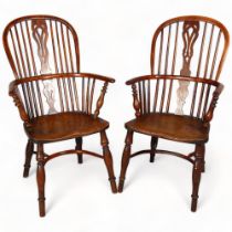 A pair of 19th century Nottingham bow arm Windsor chairs, stamped "Nicholson Rockley", yew and