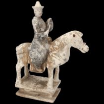 A Chinese Tang style terracotta horse and rider, height 35cm