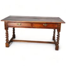 An 18th century oak farmhouse table/writing desk, with 2 frieze drawers, barley twist supports and