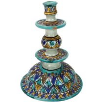 A Moroccan pottery candlestick, with painted decoration, height 24cm Chipped top rim, otherwise good