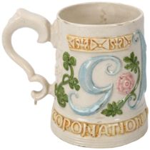 Compton Pottery George V Coronation pint mug with relief moulded decoration, height 11cm Slight