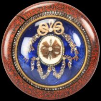 Early 19th century French circular lacquer box, the lid having a blue enamel panel under dome glass,