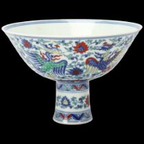 A Chinese porcelain stemmed bowl, hand painted phoenix and blossom designs, character marks under