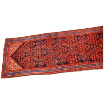 A Persian Hamadan runner, hand-made red and blue wool, 310 x 103cm