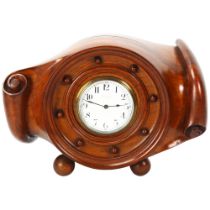 A beautifully carved aircraft propeller hub mantel clock, circa 1910, with enamel dial and 8-day