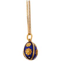 A Continental 18ct gold blue enamel egg pendant necklace, on 18ct fine curb link chain, the egg