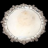 A George V silver salver, Atkin Brothers, Sheffield 1925, circular scalloped form with cast shell
