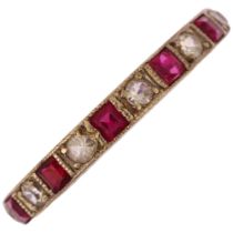 An Art Deco 9ct white gold ruby and paste full eternity ring, set with calibre-cut rubies and