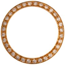 A Custom yellow gold diamond watch bezel, pave set with modern round brilliant-cut diamonds, total