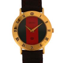 GUCCI - a lady's gold plated 3000L quartz wristwatch, circa 1992, green and red strip dial, with