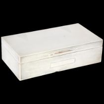 An Art Deco George V silver cigarette box, Mappin & Webb Ltd, Coronation hallmarks London 1934,