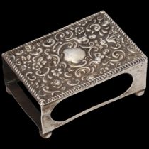 An Edwardian silver table matchbox holder, Daniel George Collins, Birmingham 1903, relief embossed