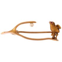 A Victorian ruby and pearl chick wishbone brooch, by Goldsmiths & Silversmiths Co Ltd, unmarked gold