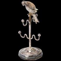 A George V novelty silver gem set combination parrot pin cushion/ring tree, Adie & Lovekin Ltd,