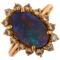 A modern 18ct gold black opal and diamond oval cluster ring, set with oval cabochon opal and