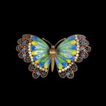 A large Continental silver-gilt plique-a-jour enamel figural butterfly brooch, maker GE, wingspan