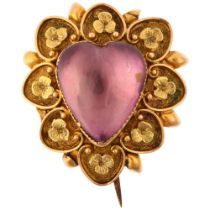 A Victorian pinchbeck? foil-backed amethyst heart mourning brooch, the central heart cabochon